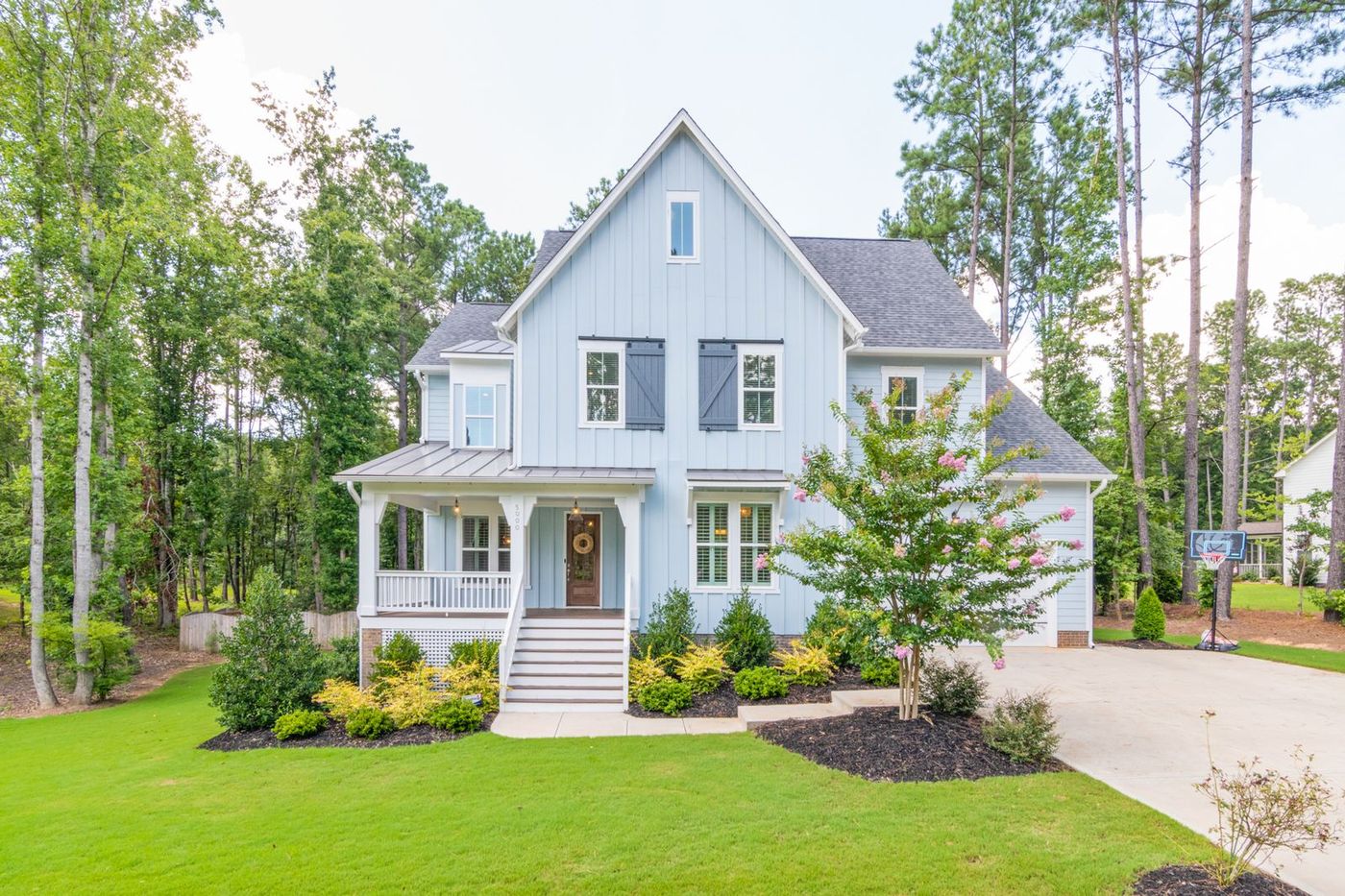 Freshly washed light-blue two-story home exterior